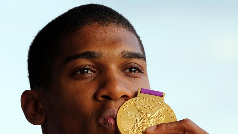 Great Britain's Anthony Joshua celebrates with his gold medal 