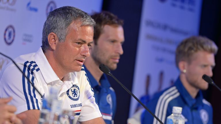 Chelsea football Manager Jose Mourinho (L) answers a question from the press next to players Petr Cech (C) and Andre Schurrle (R) during a press conference at a hotel in Bangkok on July 12, 2013.