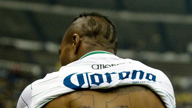 Santo's Christian Benitez celebrates after scoring against America during the Mexican Apertura Tournament semi final match 2010