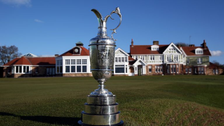 The Claret Jug trophy beside the 18th green in front of the clubhouse at Muirfield