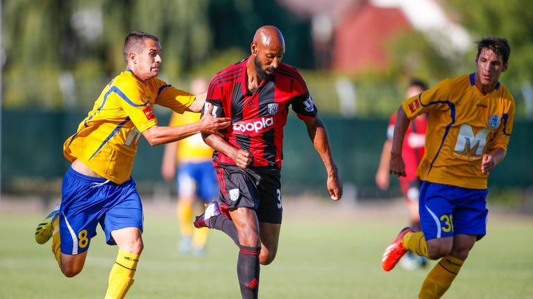 Nicolas Anelka challenges Rolawy Baracskai and Norbert Farkas during the pre-season friendly match between Puskas FC Academy and West Bromwich Albion in Hungary.