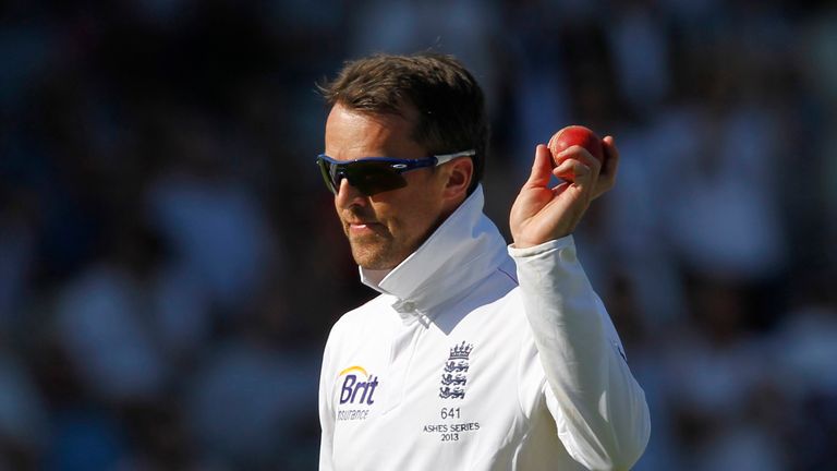 England's Graeme Swann acknowledges the crowd with the match ball after taking 5 Australian wickets on the second day of the second Ashes cricket test match between England and Australia at Lord's cricket ground in north London, on July 19, 2013. Australia were bowled out for 128, giving England a first Innings lead of 233