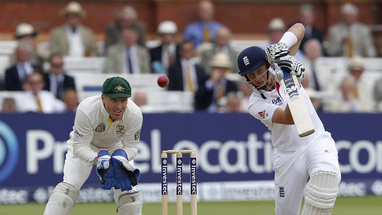 England's Joe Root plays a shot watched by Australia's wicketkeeper Brad Haddin (L) during play on the third day of the second Ashes cricket test match between England and Australia at Lord's cricket ground in north London, on July 20, 2013