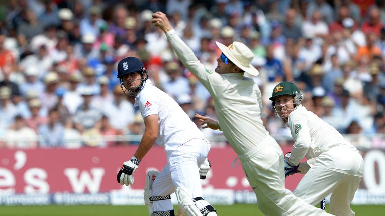England's Alistair Cook (L) is caught by Australia's Michael Clarke (C) during the third day of the first Ashes Test