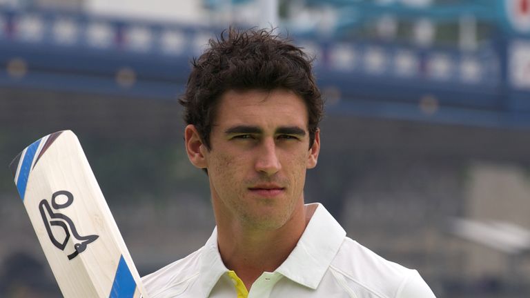 Australian cricketer Mitchell Starc poses for a photo after playing a game of cricket on a barge in the river Thames by Tower Bridge