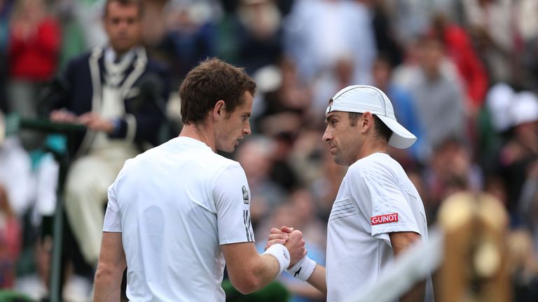 LONDON, ENGLAND - JUNE 24:  Andy Murray of Great Britain shakes hands at the net with Benjamin Becker of Germany after their Gentlemen's Singles first round match on day one of the Wimbledon Lawn Tennis Championships at the All England Lawn Tennis and Croquet Club on June 24, 2013 in London, England.  (Photo by Clive Brunskill/Getty Images)