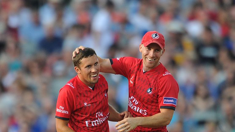 MANCHESTER, ENGLAND - JULY 24: Simon Kerrigan (L) of Lancashire Lightning is congratulated by team-mate Steven Croft after dismissing Jack Leaning of Yorkshire Carnegie during the Friends Life T20 match between Lancashire Lightning and Yorkshire Carnegie at Old Trafford on July 24, 2013 in Manchester, England. (Photo by Chris Brunskill/Getty Images )