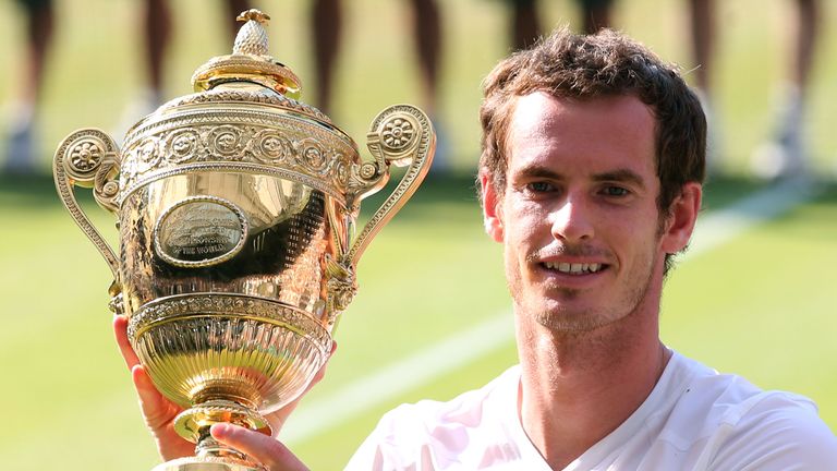 Andy Murray poses with the Wimbledon trophy