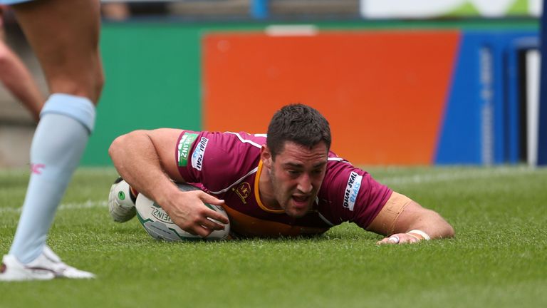 Hudderfield Giants' Joe Wardle scores a try during the Super League match at the John Smith's Stadium, Huddersfield.
