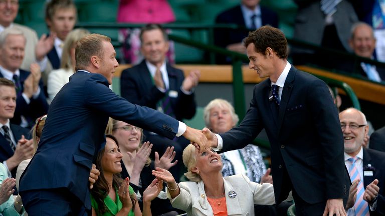 Andy Murray and Sir Chris Hoy in the royal box during day six of the Wimbledon Championships at The All England Lawn Tennis and Croquet Club, Wimbledon.