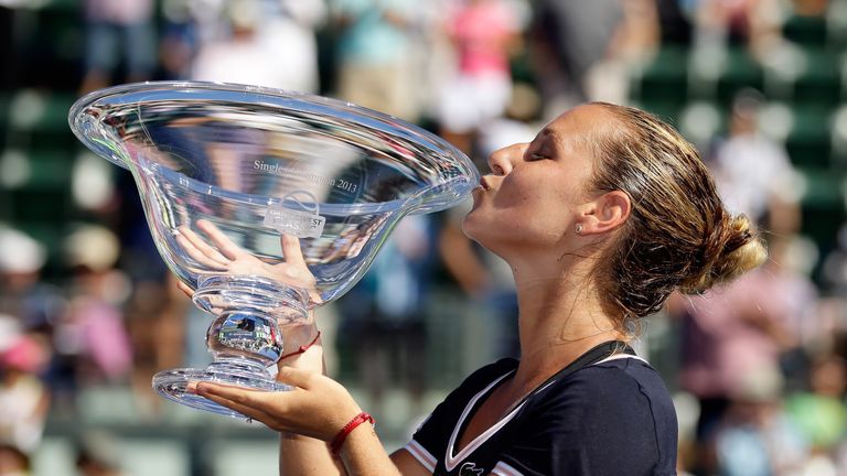 Dominika Cibulkova of Slovakia kisses the trophy after beating Agnieszka Radwanska of Poland in the finals on Day 7 of the Bank of the West Classic at Stanford University Taube Family Tennis Stadium on July 28, 2013 in Stanford, California