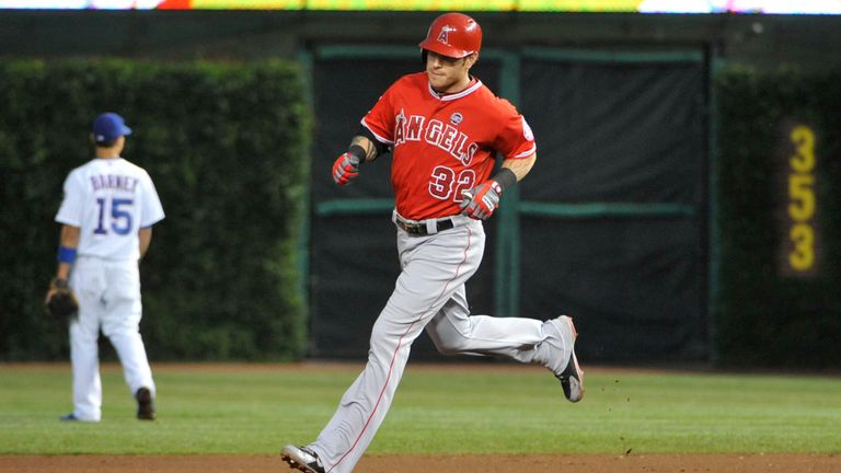Josh Hamilton of the Los Angeles Angels of Anaheim runs the bases after hitting his second homer of the game against the Chicago Cubs during the fifth inning on July 10, 2013 at Wrigley Field
