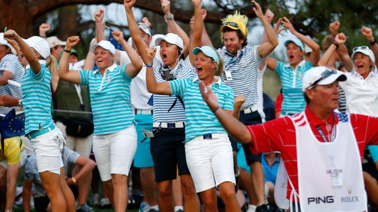 Europe celebrate Karine Icher's putt on the 18th.