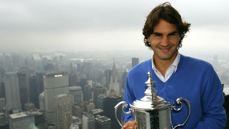 The 2008 US Open Champion poses with his trophy on a viewing deck at the Empire State Building in New York City
