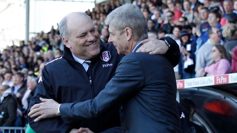 Arsenal's French manager Arsene Wenger (R) and Fulham's Dutch manager Martin Jol (L) shake hands before kick off of the English Premier League football match between Fulham and Arsenal at Craven Cottage in London on April 20, 2013. 