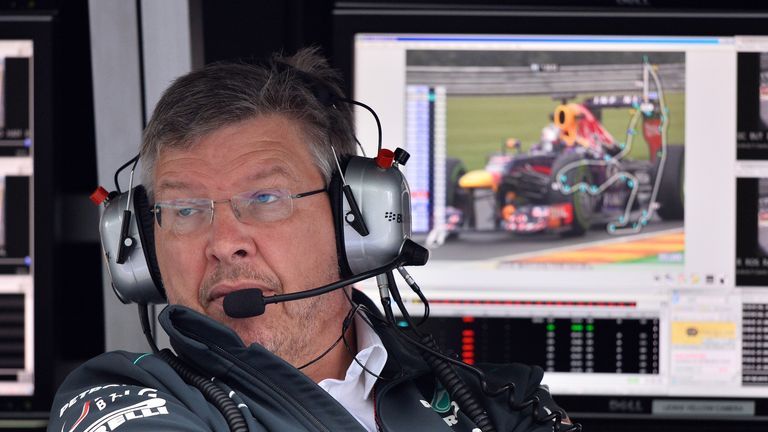 Ross Brawn looks into the Mercedes garage