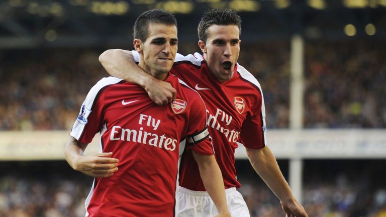 Cesc Fabregas of Arsenal is congratulated by teammate Robin van Persie after scoring his team's fourth goal during the Barclays Premier League match between Everton and Arsenal at Goodison Park.