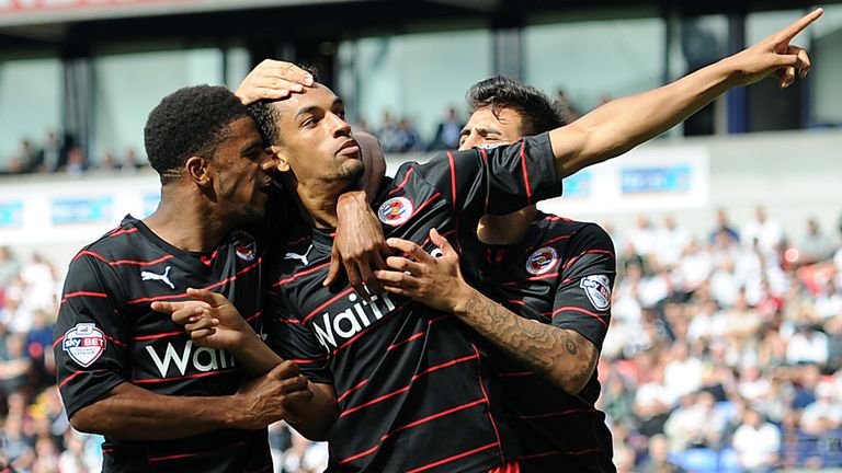 BOLTON, ENGLAND - AUGUST 10: Nick Blackman of Reading is congratulated by team-mates Gareth McCleary and Jem Karacan after scoring the equaliser from the penalty spot during the Sky Bet Championship match between Bolton Wanderers and Reading at Reebok Stadium on August 10, 2013 in Bolton, England. (Photo by Chris Brunskill/Getty Images)