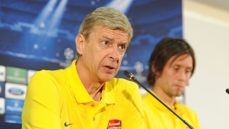 ISTANBUL, TURKEY - AUGUST 20: Arsene Wenger and Tomas Rosicky of Arsenal during a Press Conference ahead of their UEFA Champions League Play Off match against Fenerbahce at Sukru Saracoglu Stadium on August 20, 2013 in Istanbul, Turkey. (Photo by Stuart MacFarlane/Arsenal FC via Getty Images)
