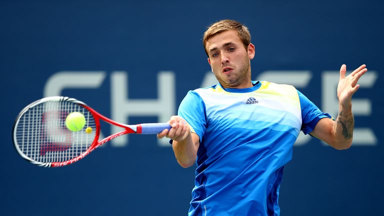 Daniel Evans of Great Britain returns a shot in the first round of the 2013 US Open