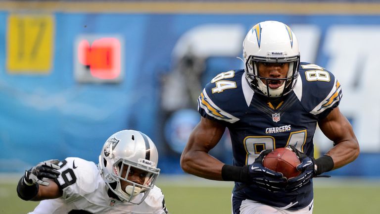 Danario Alexander of the San Diego Chargers catches the ball while being covered by Brandian Ross of the Oakland Raiders