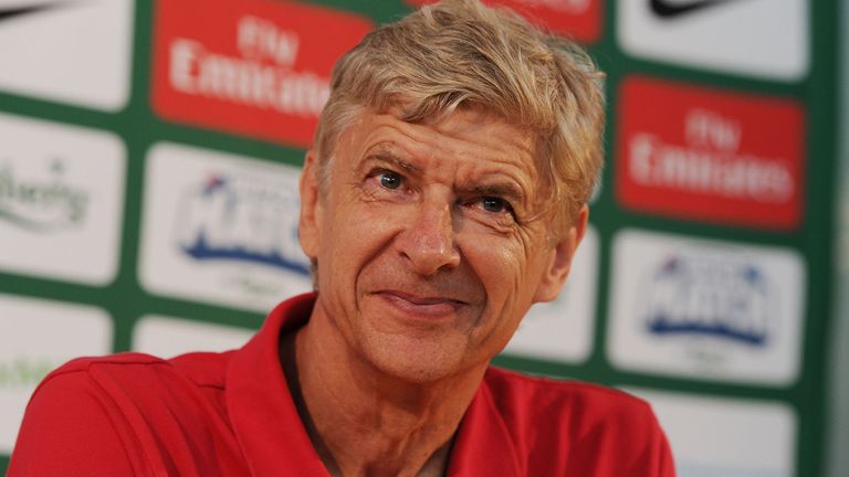 HELSINKI, FINLAND - AUGUST 09: Arsenal manager Arsene Wenger attends a press conference after arriving at Helsinki Vantaa Airport on August 09, 2013 in Helsinki, Finland. (Photo by Stuart MacFarlane/Arsenal FC via Getty Images)