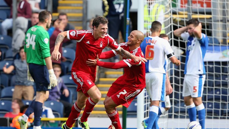 Darius Henderson of Nottingham Forest celebrates after scoring the winning goal with team mate Adlene Guedioura during the Sky Bet Championship match between Blackburn Rovers and Nottingham Forest at Ewood Park on August 10, 2013