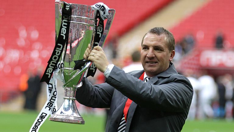Swansea City manager Brendan Rodgers celebrates with the Championship Play Off trophy