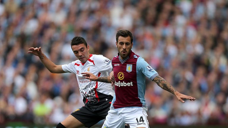 Liverpool's Iago Aspas and Aston Villa's Antonio Luna battle for the ball
