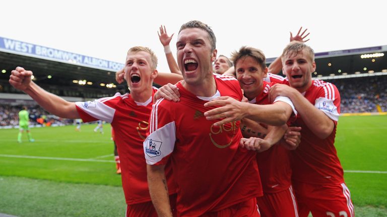 Rickie Lambert of Southampton celebrates scoring the winning goal with team mates during the Barclays Premier League match between West Bromwich Albion and Southampton at The Hawthorns on August 17, 2013.