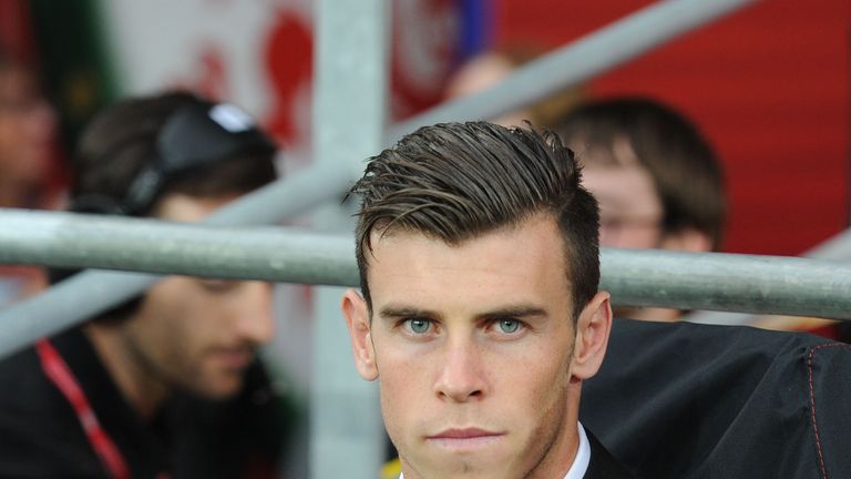 Gareth Bale sits on the subs bench during the International Friendly match between Wales v Ireland at the Cardiff City Stadium.