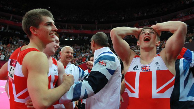 Max Whitlock and Sam Oldham of Great Britain react after hearing the scores on the final rotation in the Artistic Gymnastics Men's Team final on Day 3 of the London 2012 Olympic Games at North Greenwich Arena on July 30.