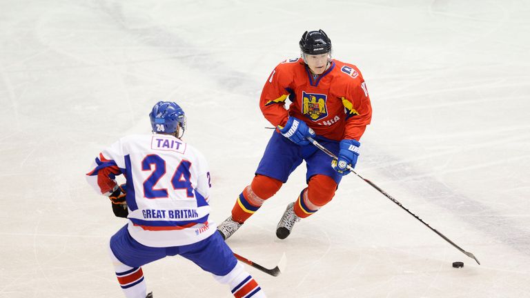 NIKKO, JAPAN - NOVEMBER 10:  Csanad Virag #11 of Romania skates against Ashley Tait #24 of Great Britain during the Ice Hockey Sochi Olympic Pre-Qualification Group J match between Romania and Great Britain at Nikko Kirifuri Ice Arena on November 10, 2012 in Nikko, Tochigi, Japan. Great Britain won 3-0.  (Photo by Getty Images)