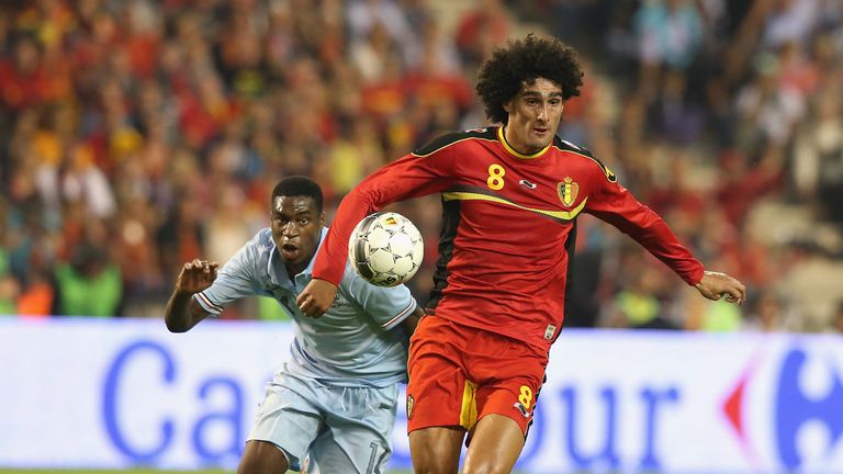 Marouane Fellaini of Belgium moves away from Geoffrey Kondogbia during the International friendly match between Belgium and France at the King Baudouin Stadium in Brussels, Belgium.