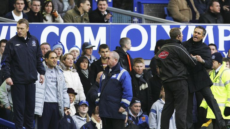 Chelsea Manager Jose Mourinho is restrained, whilst Everton Manager David Moyes looks on 