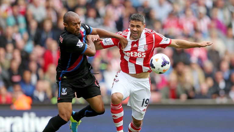 Danny Gabbidon of Crystal Palace (L) holds off Jonathan Walters of Stoke during the Barclays Premier League match between Stoke City and Crystal Palace at Britannia Stadium on August 24, 2013.