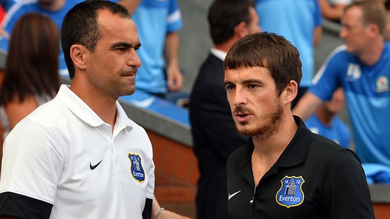 Everton's English defender Leighton Baines (R) gestures to Everton's Spanish manager Roberto Martinez (L) ahead of the pre-season friendly football match between Blackburn Rovers and Everton at Ewood Park, Blackburn, north-west England on July 27, 2013. AFP PHOTO/PAUL ELLIS        (Photo credit should read PAUL ELLIS/AFP/Getty Images)