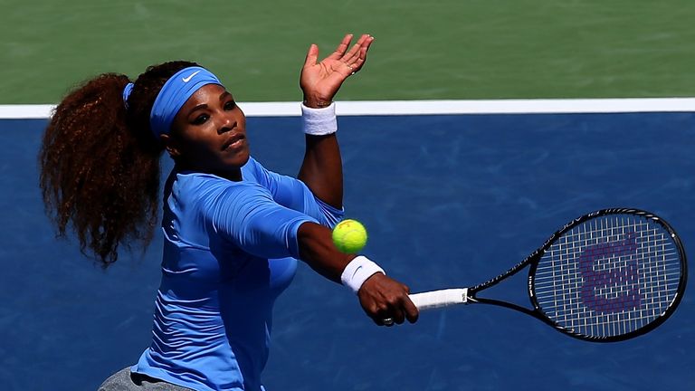 Serena Williams returns a shot to Eugenie Bouchard of Canada during the Western & Southern Open