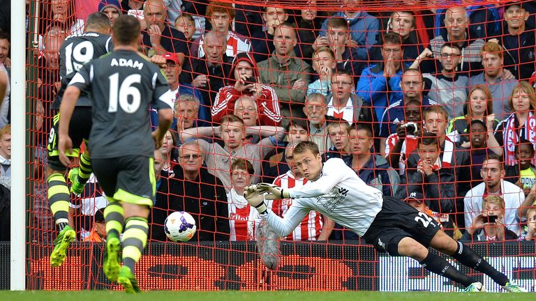 Simon Mignolet becomes the man of the moment, as he stops Jonathan Walters' penalty to secure a 1-0 win for the Reds.