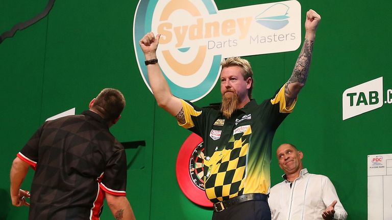 Simon Whitlock of Australia celebrates winning his first round match against Jamie Mathers of Australia during the Sydney Darts Masters at Luna Park