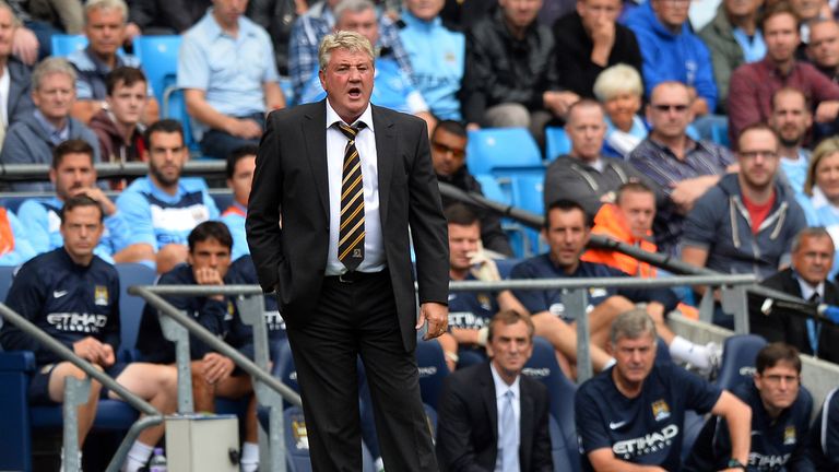 Hull City's English manager Steve Bruce looks on during the English Premier League football match between Manchester City and Hull City at the Etihad Stadium