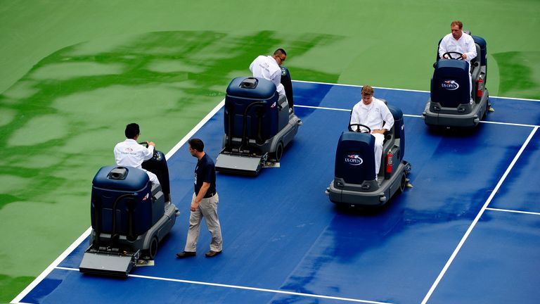 Center court is dried following a rain delay on day three of the 2013 US Open