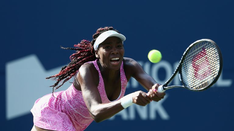 Venus Williams of the USA  hits a return during her match against Kristen Flipkins of Belgium at the WTA Rogers Cup in Toronto