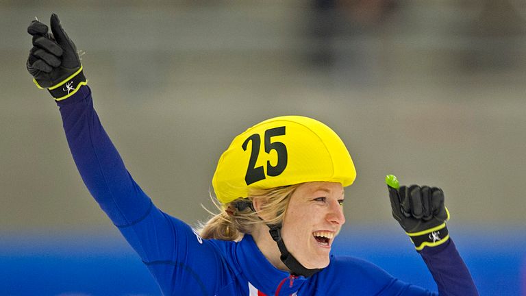 British Elise Christie celebrates after winning the women's 1500m a final race of the ISU World Cup short track speed skating event in Dresden, eastern Germany, on February 9, 2013.