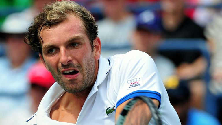 - Benneteau of France returns a shot to Tomas Berdych of the Czech Repubic during their 2013 US Open mens singles match 