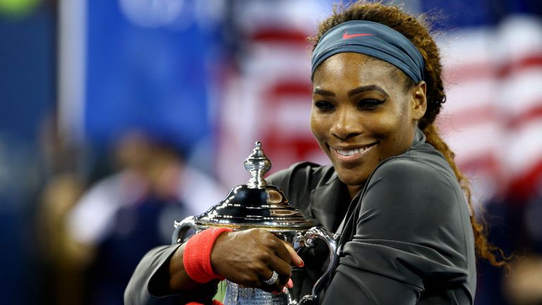 - Williams of the United States of America smiles as she poses with the trophy after winning her womens singles final match against Victoria Azarenka of Belarus