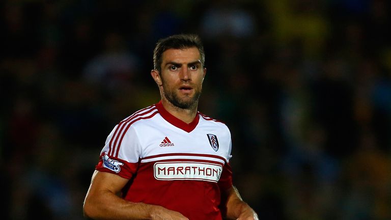 Aaron Hughes of Fulham in action during the Capital One Cup Second Round match between Burton Albion and Fulham at the Pirelli Stadium