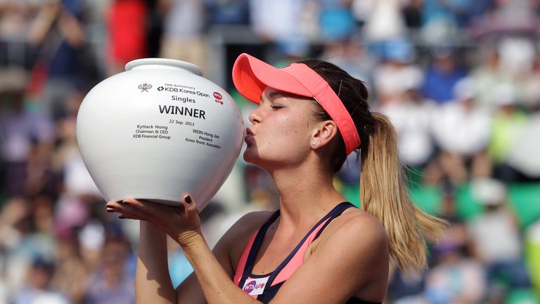 Agnieszka Radwanska of Poland celebrates after defeating Anastasia Pavlyuchenkova of Russia to win the final on day seven of the KDB Korea Open 2013 at Seoul Olympic Park Tennis Center on September 22, 2013 in Seoul, South Korea