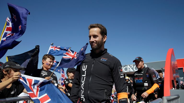 Sir Ben Ainslie of Oracle Team USA walks off the stage from the dock-out show before going out to race against Emirates Team New Zealand in race 17 of the America's Cup Finals on September 24, 2013 in San Francisco, California. 