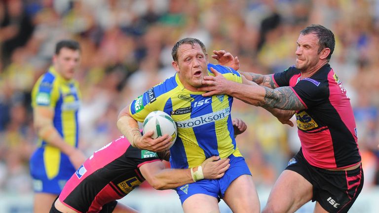 Warrington Wolves' Ben Westwood is tackled by Leeds Rhinos Jamie Peacock (right) and Carl Ablett during the Super League match at the Halliwell Jones Stadium, Warrington.